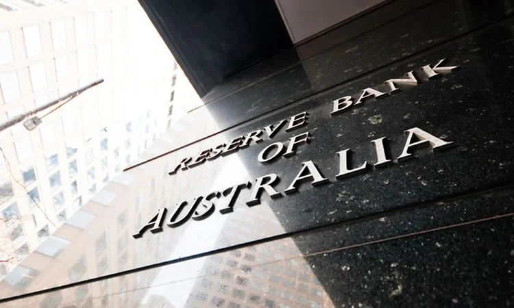 Australian central bank cuts key rate but warns of global disquiet
